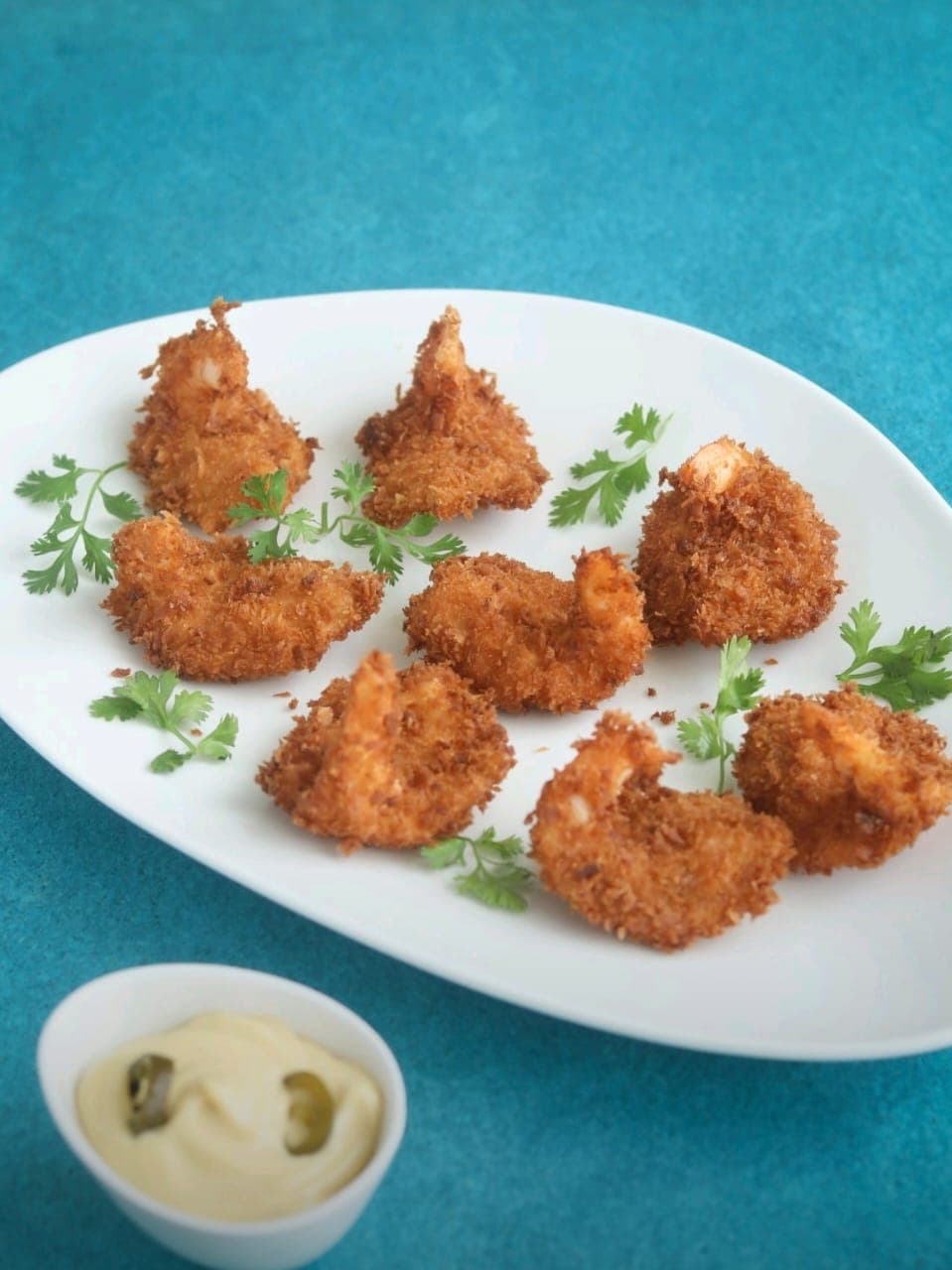 A school of silver fish swimming in unison.